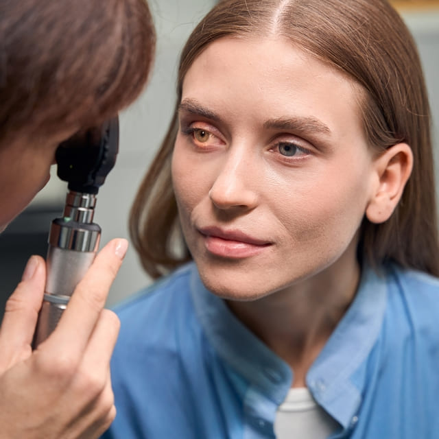 young woman having her eyes checked